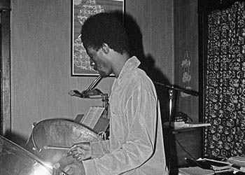 Clyde with steel drums No. 4   -   Oak Park, IL, 1983   -   Kodak Tri-X black & white 35mm film