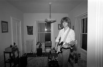 Paul Braucher strumming   -   Oak Park, IL, 1982   -   Kodak Tri-X black & white 35mm film