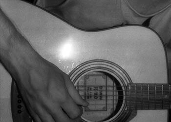 Paul Braucher with 6-string close-up   -   New York City, 1985   -   Kodak infrared black & white 35mm film