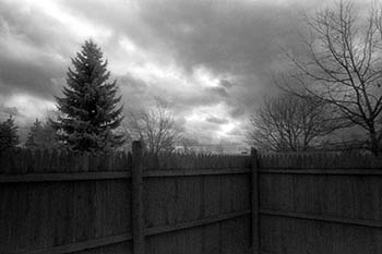 Fence clouds   -   Adrian, MI, 1982   -   Kodak infrared black & white 35mm film