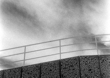 Railing & clouds   -   River Grove, IL, 1982   -   Kodak infrared black & white 35mm film