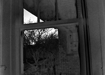 Sabattier window   -   Oak Park, IL, 1982   -   Kodak Tri-X black & white 35mm film