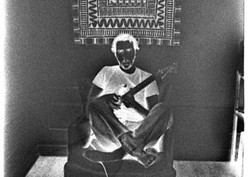 Self-portrait with guitar solarized   -   Oak Park, IL, 1982   -   Ilford HP5 Plus black & white 35mm film